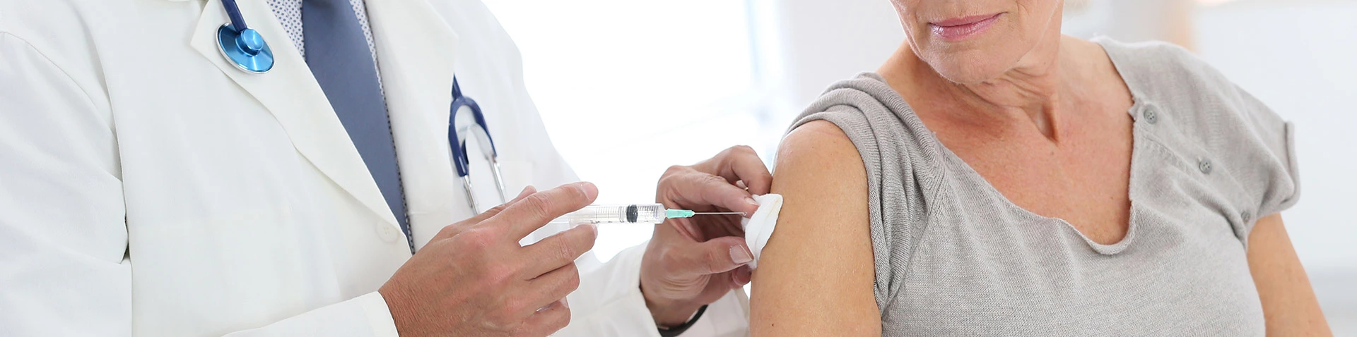 pharmacist giving a vaccine